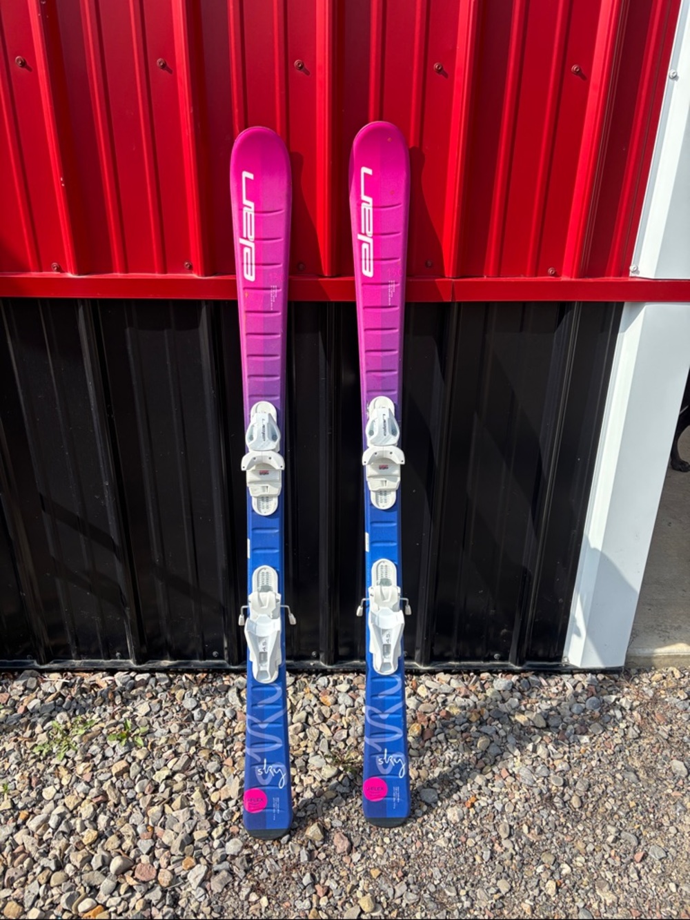 Elan Pink-to-Blue Gradient Skis with White Bindings